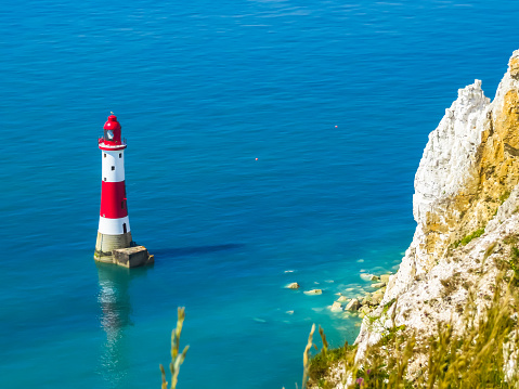 White chalk cliffs and Beachy Head Lighthouse. Eastbourne, East Sussex, England