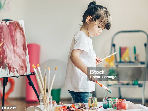 Cut Girl Painting In At Her Home Stock Photo - Download Image Now - Child, Painting - Activity, Art