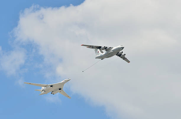 Ilyushin IL-78 and Tupolev Tu-160 demonstrate aerial refueling Moscow, Russia - May 7, 2016: Soviet air tanker Ilyushin IL-78 and Tupolev Tu-160 (White Swan) supersonic variable-sweep wing strategic bomber demonstrate aerial refueling at the final rehearsal of the Victory Day parade in Moscow. tu160 stock pictures, royalty-free photos & images