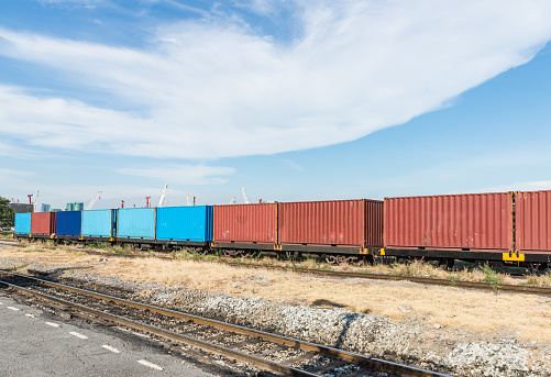 Container wagon of the freight train near the construction area.