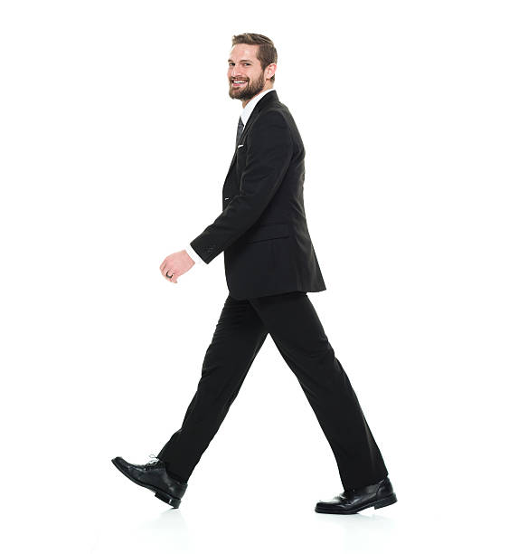 istock Cheerful businessman walking 538057318