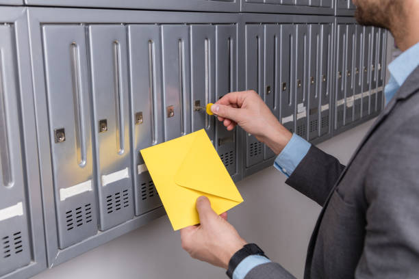 istock Man in suit checking mails in the mailbox 538059834