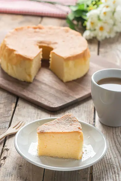 Photo of Chiffon cake on white dish with coffee.