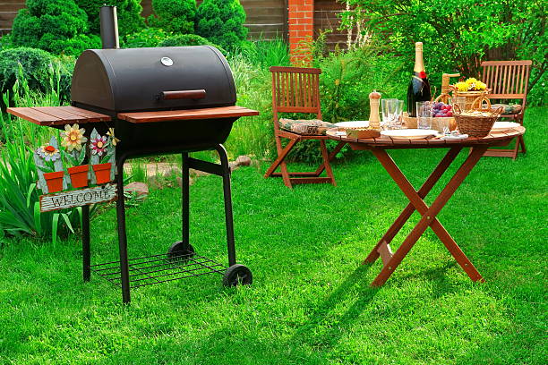 istock Backyard BBQ Party With Charcoal Grill, Wine and Served Table 538060686