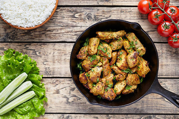 istock Fried sliced chicken or turkey fillet meat with cucumber 538060996