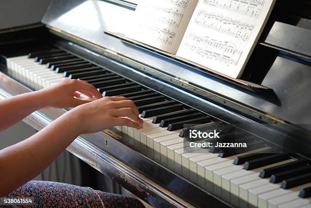 Girl Playing The Piano Stock Photo - Download Image Now - Sheet Music, Child, Learning