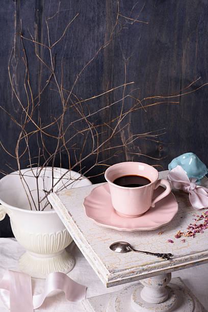 istock Morning coffee in pink vintage cup on antique table. 538062978
