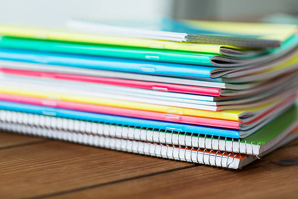 istock close up of notebooks on wooden table 538063560