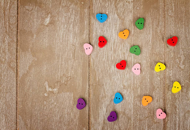 istock hearts on wooden background 538064025