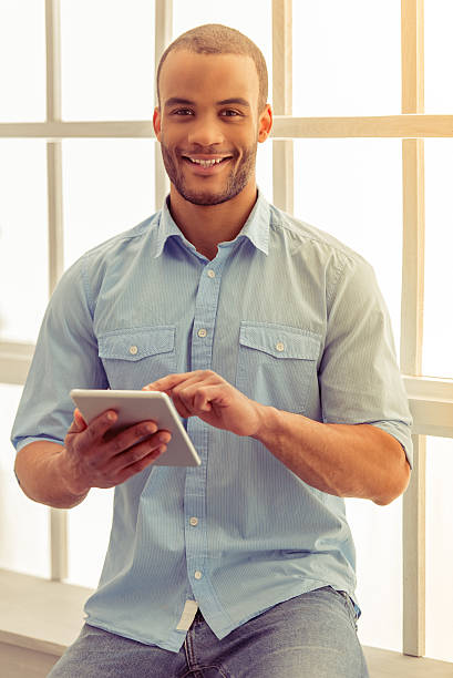 istock Afro American businessman with gadget 538064092