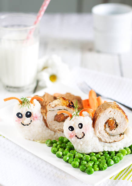 Food art Food art - snails made from rice and chicken happy green peas stock pictures, royalty-free photos & images