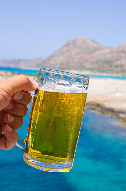 Glass of cold beer in tropical climate