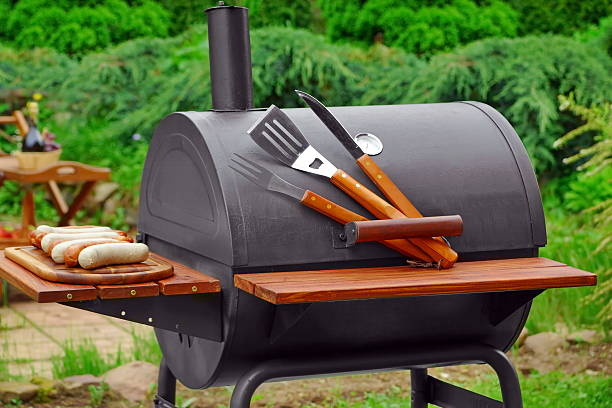 istock Summer Weekend BBQ Scene With Charcoal Grill On The Backyard 538065050