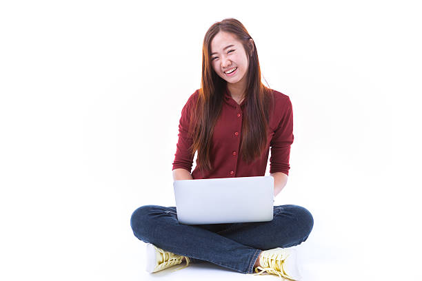 istock Woman student sitting with laptop isolated on white background. 538066138