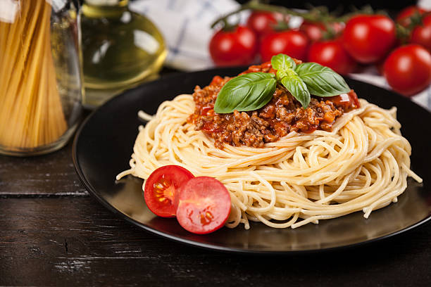 istock Spaghetti bolognese on dark background 538066326