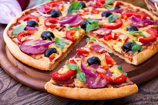 istock Delicious pizza served on wooden table 538066391
