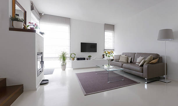 living room with leather sofa and glass table