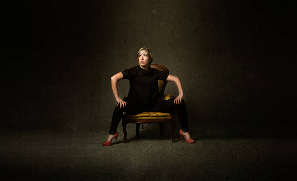 istock girl sitting on yellow sofa and thinking 538067139