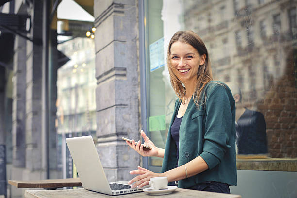 istock smiling woman working on laptop 538067256