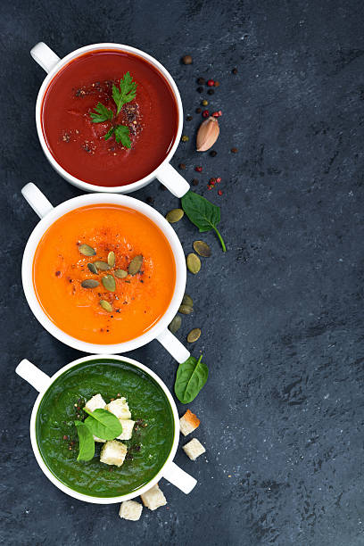 istock assortment of vegetable cream soup on and dark background 538067514