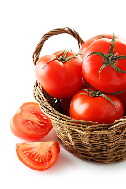 istock Fresh red tomatos in basket isolated on white 538067889