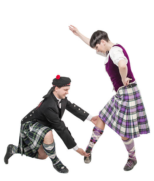 istock Man in kilt teaching woman Scottish dance 538068198