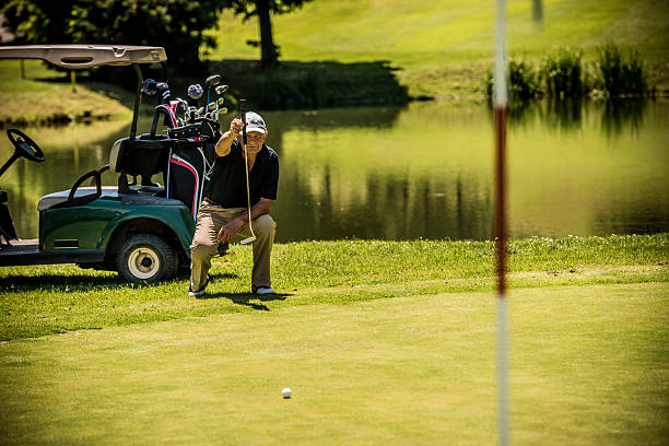 istock Senior Golfer on a Golf Course With a Golf Cart 538068615