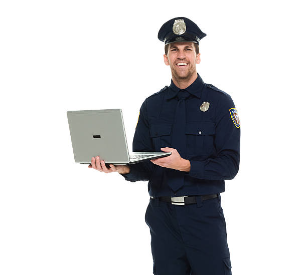 istock Smiling police working on laptop 538068704