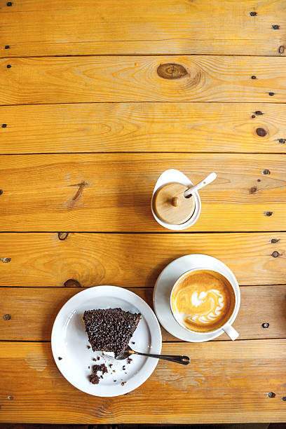 istock cup of coffee and chocolate cake on a wooden table 538069142
