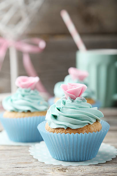 istock Tasty cupcake on grey wooden background 538069481