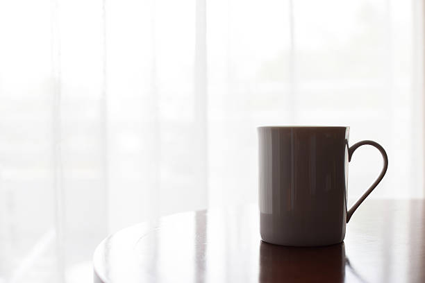istock Coffee cup on table in coffee shop with vintage filter 538069726