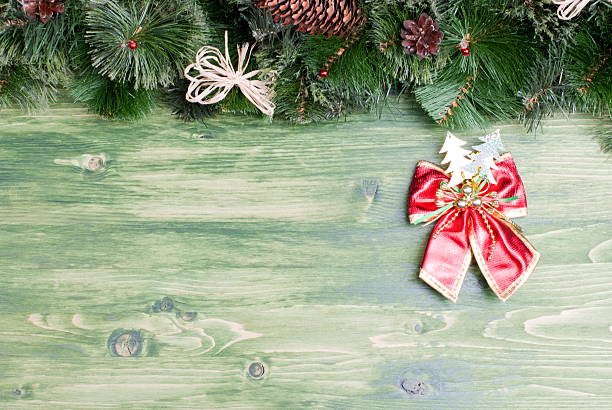 istock green board with pine needles and cones Christmas toys 538069913