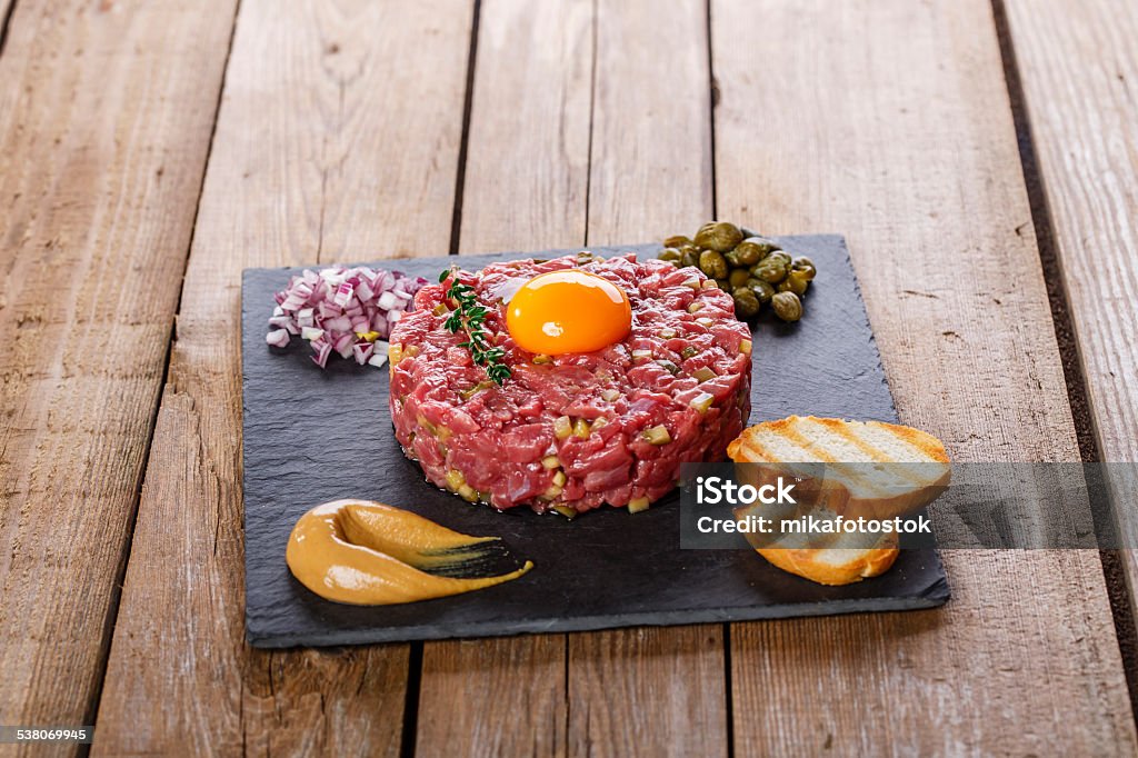 Beef tartare with capers yolk and mustard 2015 Stock Photo