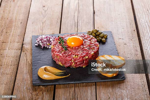 Beef Tartare With Capers Yolk And Mustard Stock Photo - Download Image Now - 2015, Backgrounds, Beef