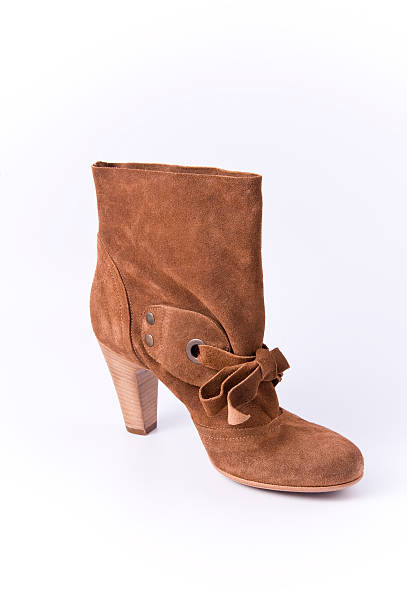 istock Women's suede low boots with high heels brown (red) color.. 538070473