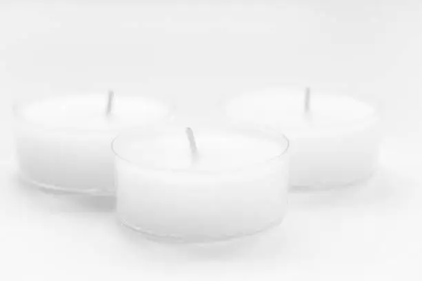 Three tealight on white