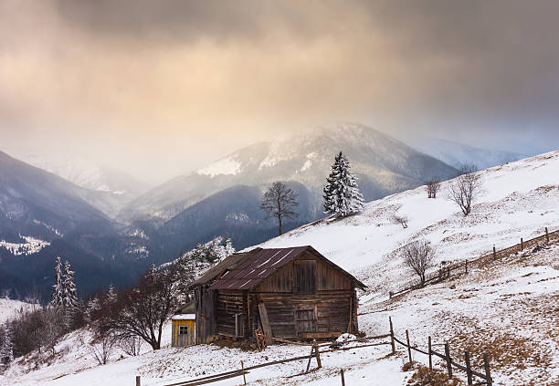 istock Old farm in the mountains at winter 538082733