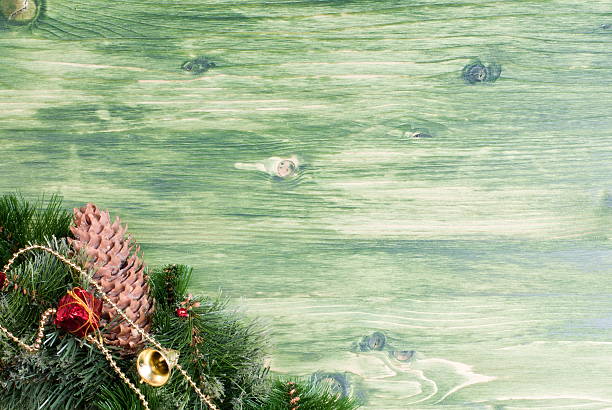istock green board with pine needles and cones Christmas toys 538083027
