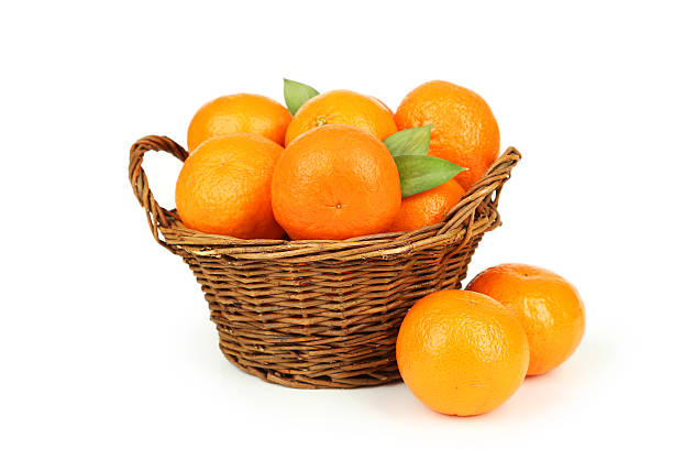 istock Mandarin in basket isolated on white 538083535