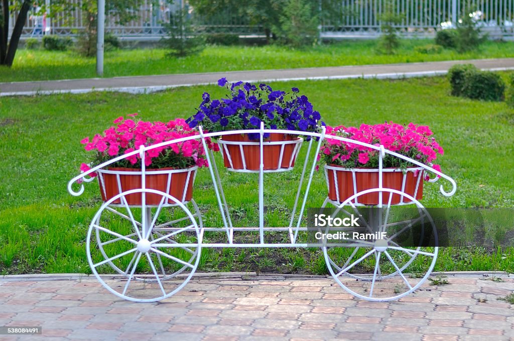 Trolley with flowers Flower beds on the truck in park 2015 Stock Photo