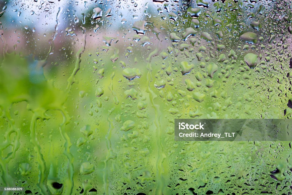 water drops on glass bright abstract background of water drops on glass 2015 Stock Photo