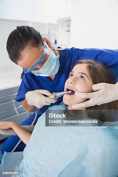 Pediatric Dentist Wearing Safety Glasses Stock Photo - Download Image Now - 10-11 Years, 20-24 Years, 20-29 Years