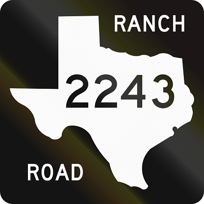 US ranch-to-market-road shield in texas. The sign contains a silhouette of the state.