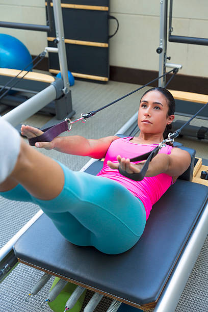 istock Pilates reformer workout exercises woman 538101071