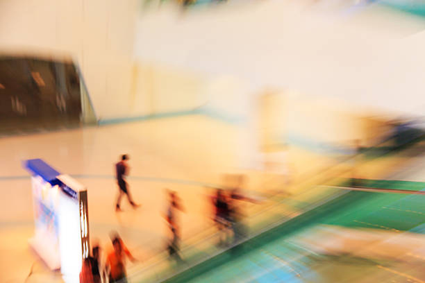 istock People in escalators at the modern shopping mall 538103113