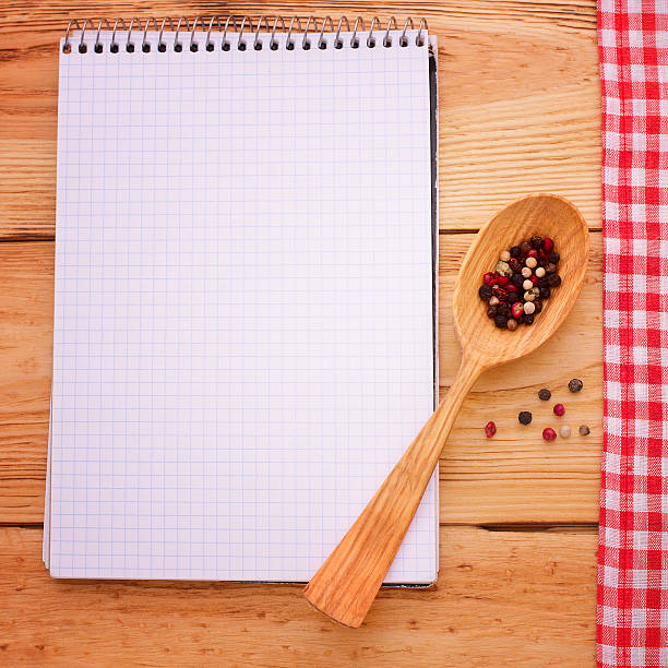 istock Pure notebook  on red checkered tablecloth tartan wooden table. 538103537