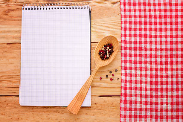 istock Pure notebook for recording menu, recipe on tablecloth tartan. 538103783