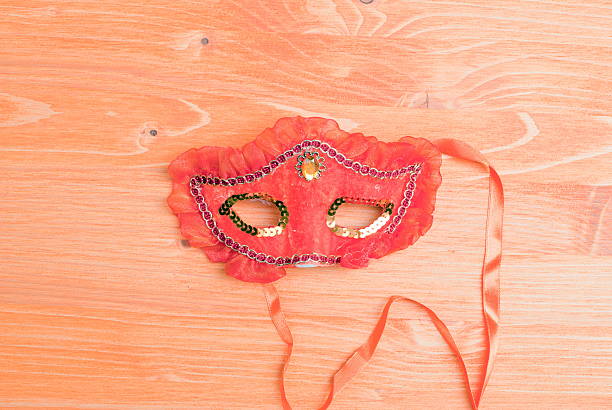 istock beautiful mask of feathers on a yellow board 538125151