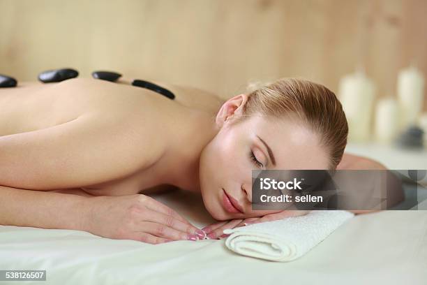 Beautiful Young Woman Getting Spa Massage Lying On Salon Stock Photo - Download Image Now