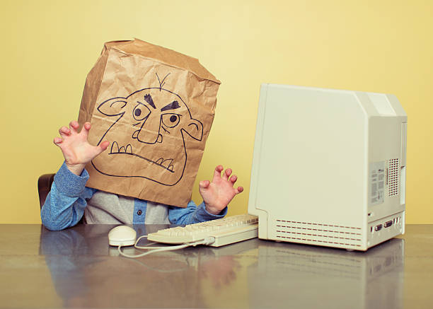 Internet Troll Is Mean At The Computer Stock Photo - Download